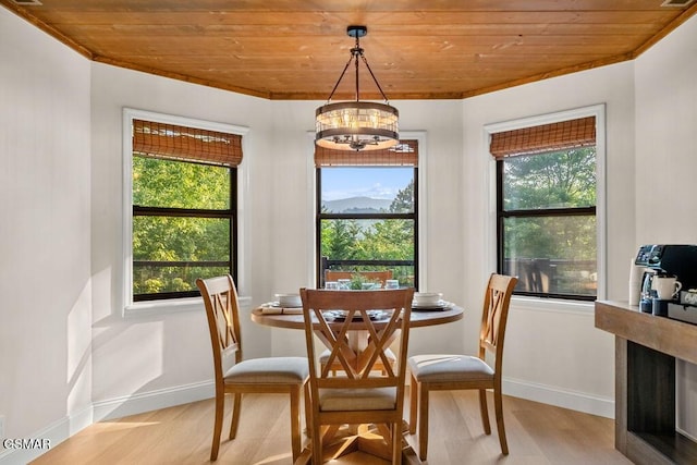 4822 White Pine Way, Sevierville, TN 37876 - dining space with light wood-style flooring, wood ceiling, a chandelier, and ornamental molding