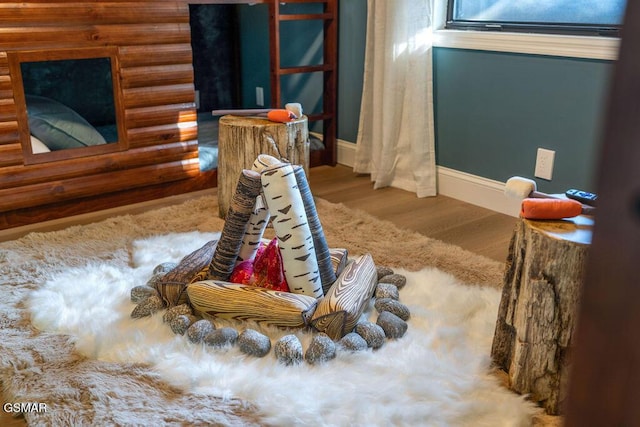 4822 White Pine Way, Sevierville, TN 37876 - sitting room featuring wood finished floors and rustic walls