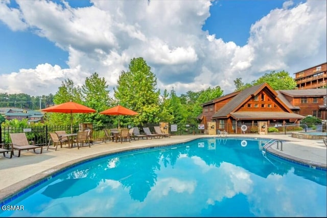 view of pool featuring a patio