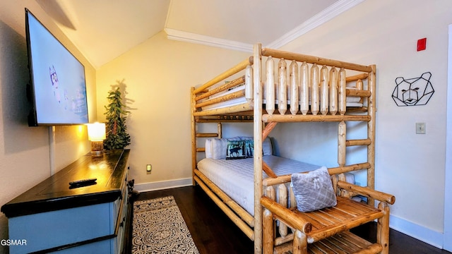 bedroom with dark wood-type flooring, lofted ceiling, and ornamental molding