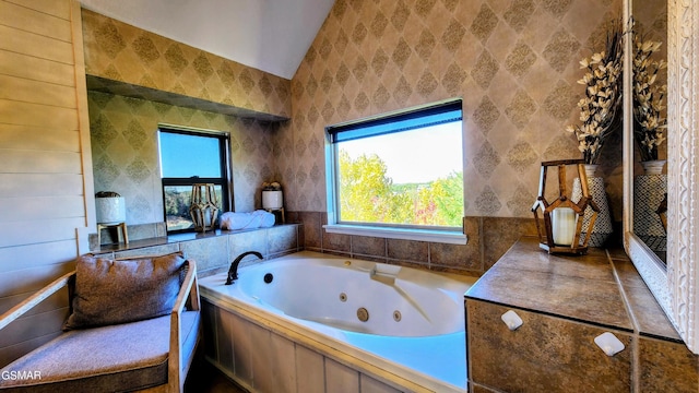 bathroom featuring lofted ceiling and a washtub