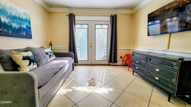 living room featuring french doors, crown molding, and light tile patterned flooring