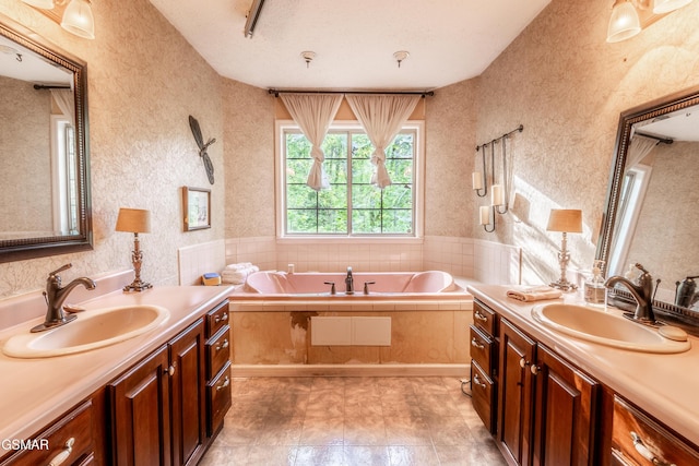 3012 Roaring Creek Way, Sevierville, TN 37862 - full bath featuring two vanities, wallpapered walls, and a bath