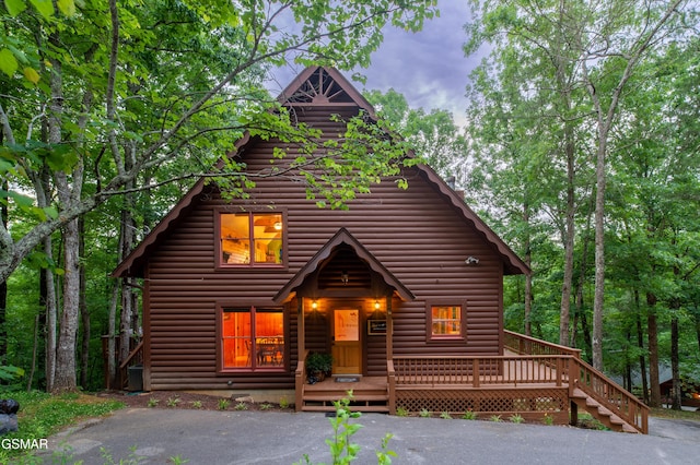 log-style house with a deck