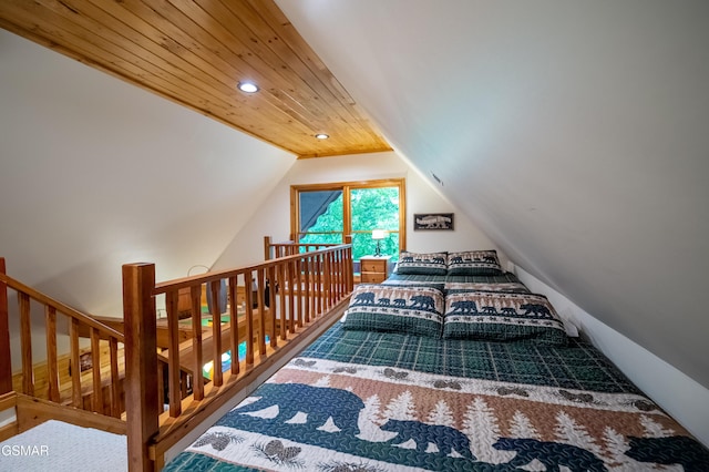 bedroom featuring wood ceiling and vaulted ceiling