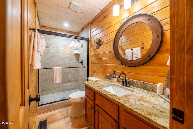 bathroom featuring wooden walls, toilet, walk in shower, wood-type flooring, and wood ceiling