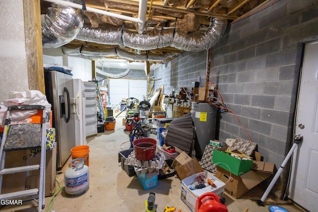 basement with stainless steel refrigerator with ice dispenser