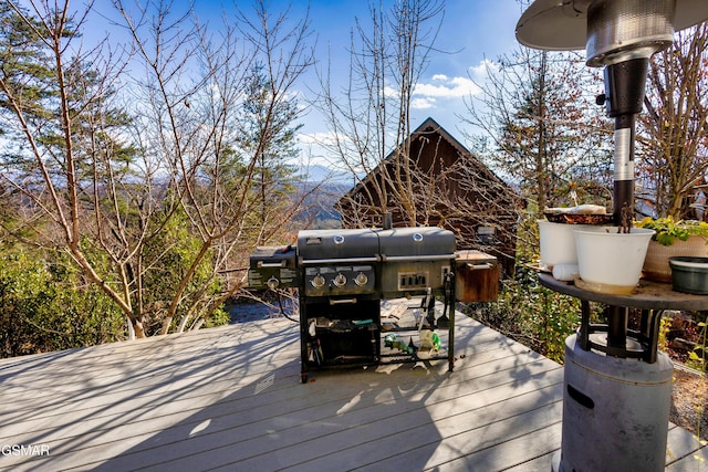 wooden deck featuring a mountain view