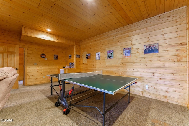 playroom featuring wooden ceiling, carpet flooring, and wooden walls