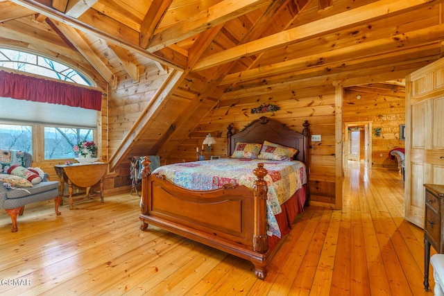 bedroom featuring vaulted ceiling with beams, light wood-type flooring, wood ceiling, and wood walls