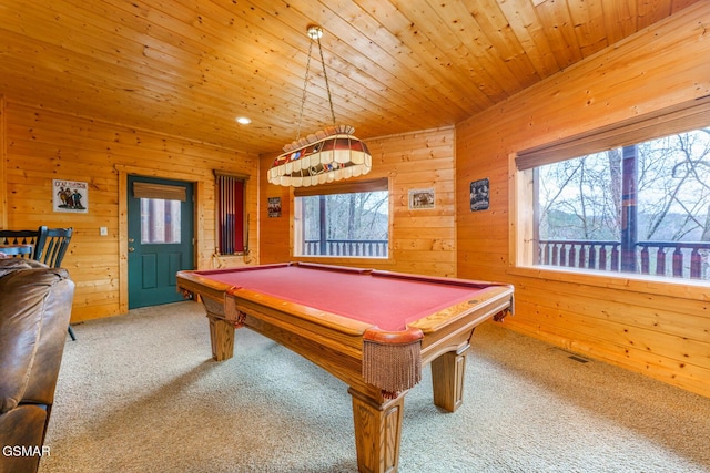 recreation room featuring carpet, visible vents, plenty of natural light, and wood ceiling