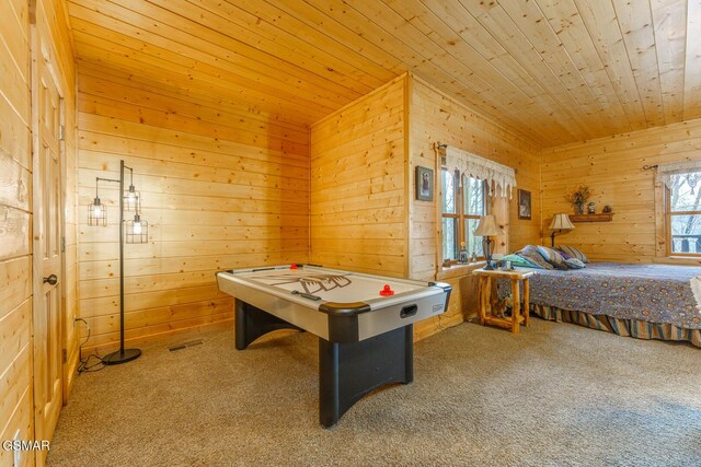 rec room featuring wooden ceiling, carpet flooring, and wooden walls