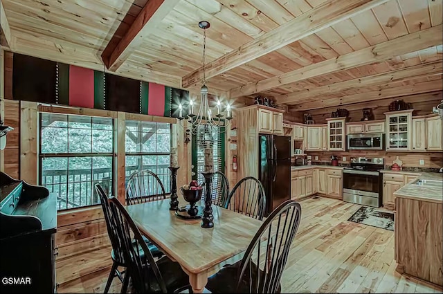 dining room with wooden ceiling with exposed beams, a chandelier, and light wood finished floors