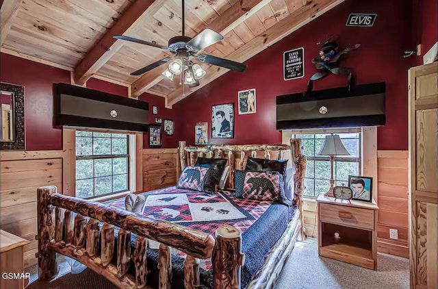 bedroom with carpet floors, wood ceiling, and multiple windows