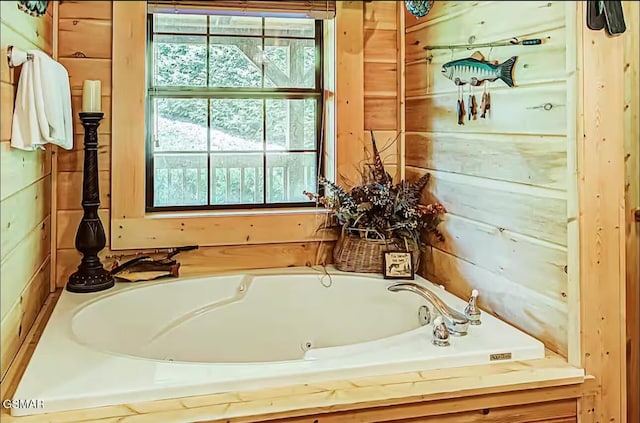 full bath with a tub with jets
