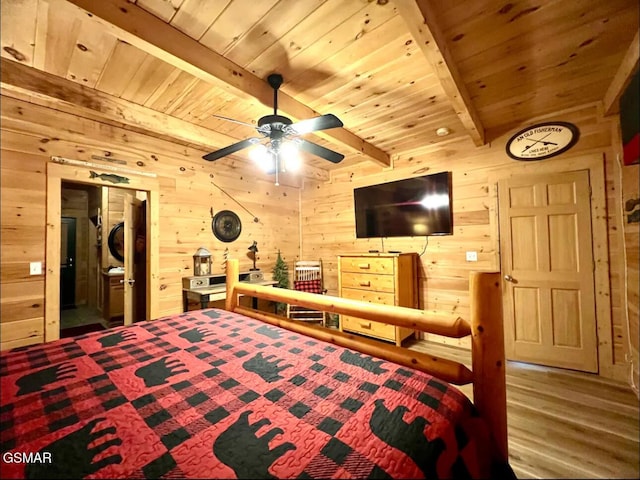 bedroom with wooden ceiling with exposed beams, wooden walls, and wood finished floors