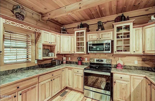 kitchen featuring stainless steel appliances, wooden ceiling with exposed beams, wood walls, light wood finished floors, and glass insert cabinets