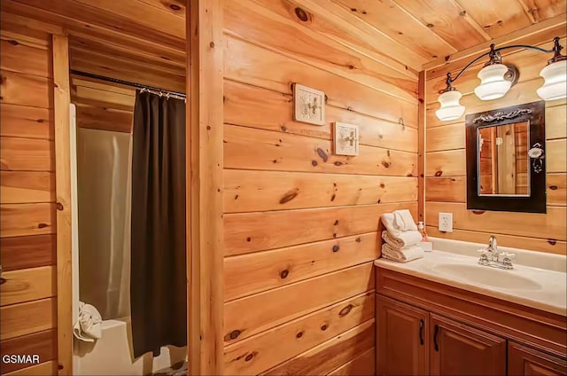 bathroom featuring vanity, wooden walls, shower / bath combo, and wood ceiling