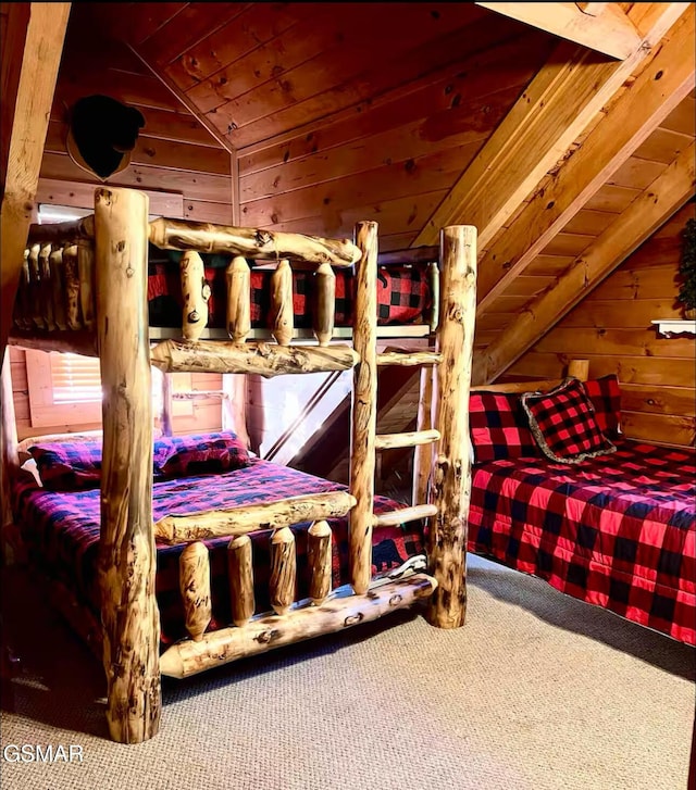 carpeted bedroom with lofted ceiling, wood walls, and wood ceiling