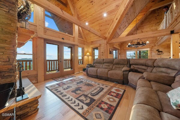 living area with wood ceiling, beamed ceiling, french doors, and hardwood / wood-style floors