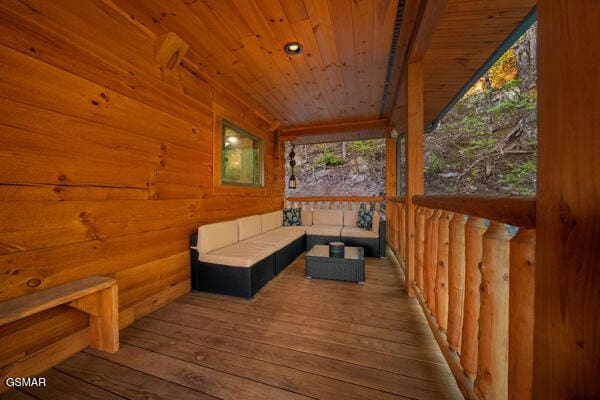 deck featuring outdoor lounge area