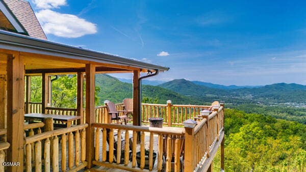 wooden deck featuring a mountain view