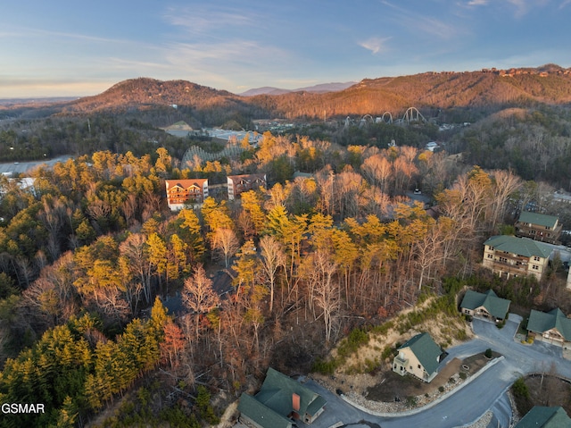 aerial view at dusk featuring a mountain view