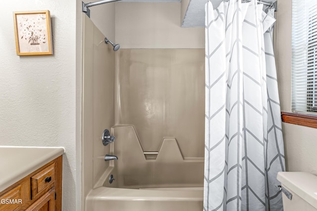 full bathroom with toilet, vanity, and shower / tub combo with curtain