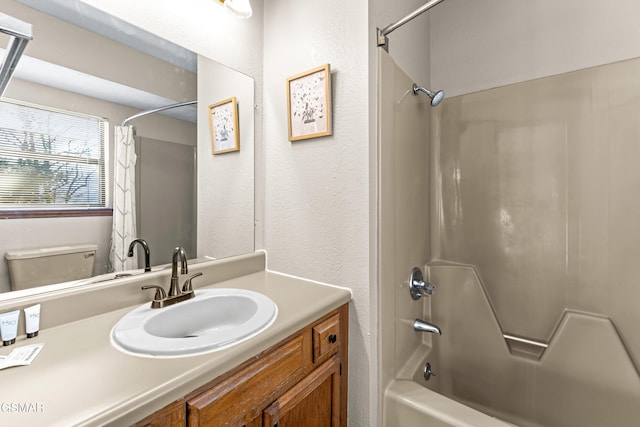 full bathroom featuring toilet, shower / bath combo, and vanity