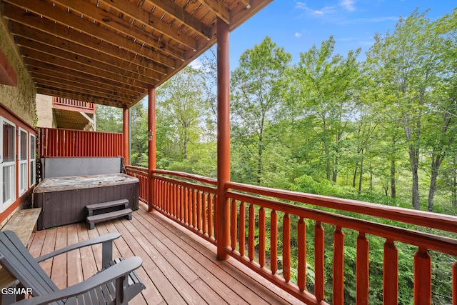 wooden deck with a hot tub