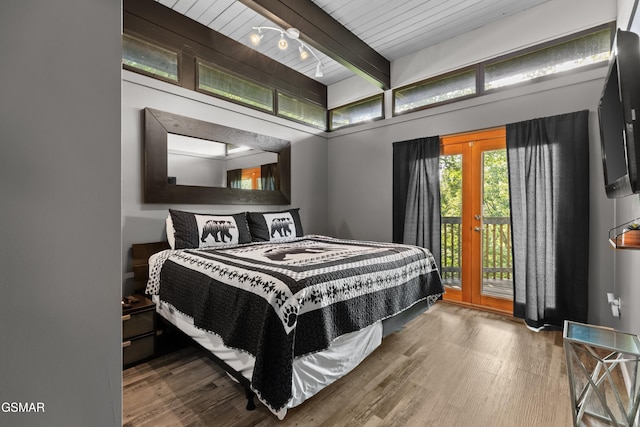 bedroom featuring wood ceiling, hardwood / wood-style flooring, beam ceiling, access to outside, and french doors