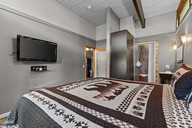 bedroom featuring wood ceiling, beam ceiling, a closet, and a high ceiling