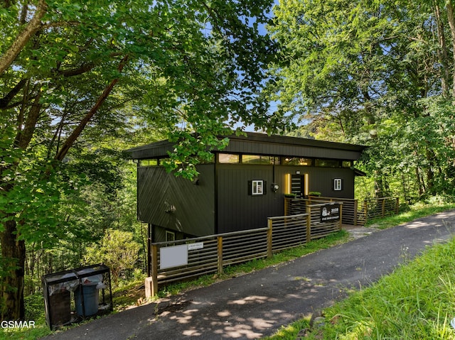 contemporary home featuring an outbuilding