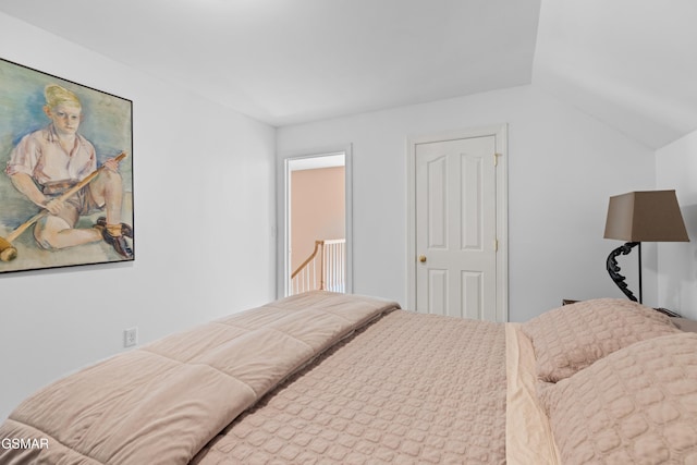 bedroom with vaulted ceiling