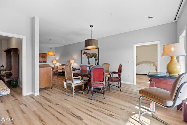 dining room with light hardwood / wood-style flooring