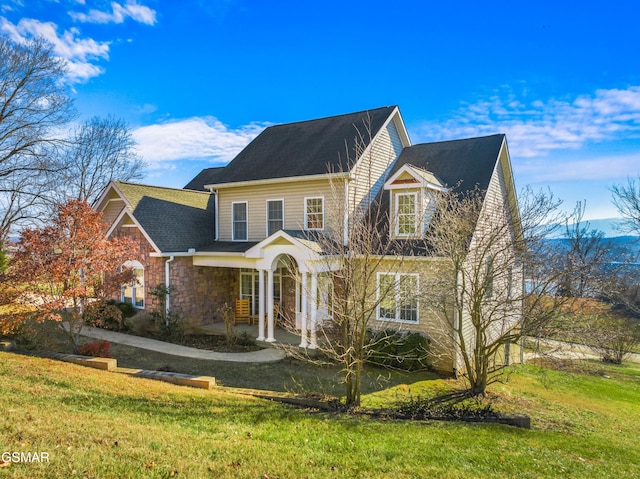 view of front of home with a front yard