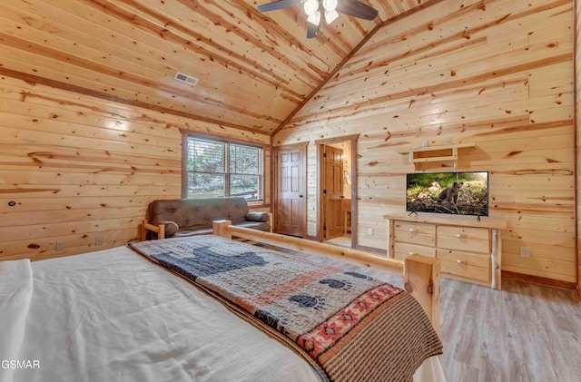 bedroom with wooden ceiling, wood finished floors, wooden walls, and visible vents