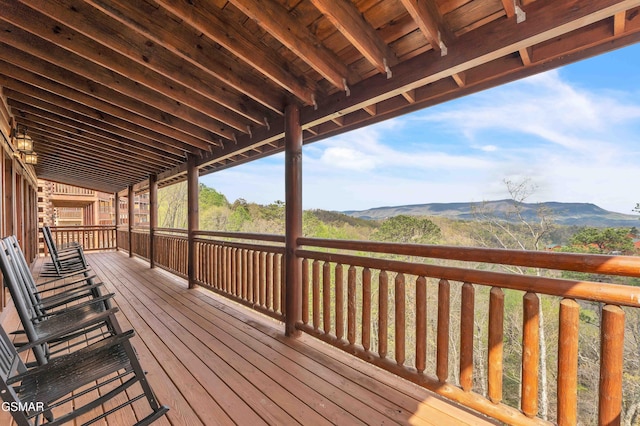 wooden terrace featuring a mountain view