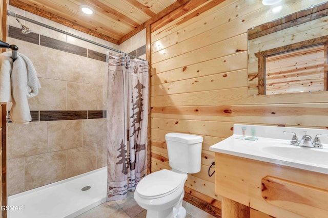 full bathroom featuring wood walls, toilet, vanity, and a stall shower