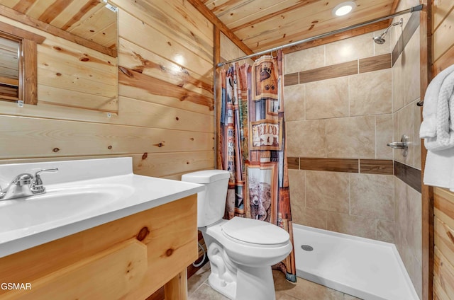 bathroom with wood walls, vanity, and a stall shower