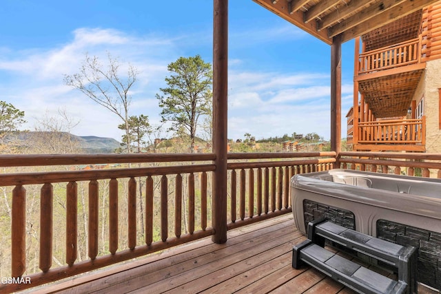 wooden terrace featuring a mountain view