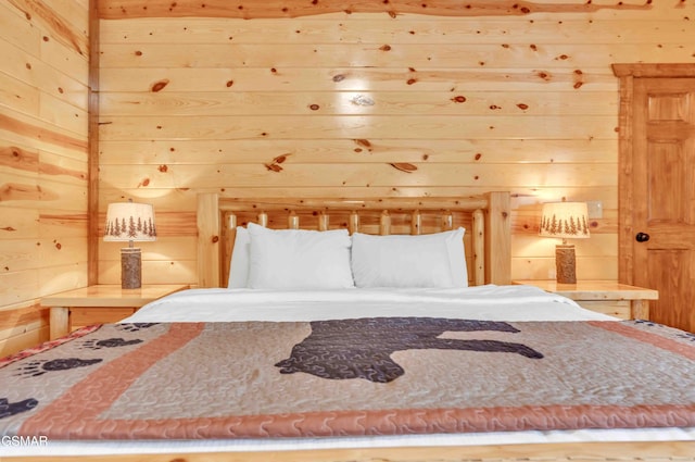 bedroom with wood walls