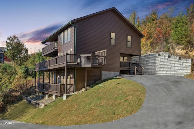 exterior space featuring a yard and a wooden deck