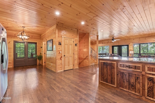 3181 Thomas Headrick Rd, Sevierville, TN 37862 - kitchen featuring a chandelier, wooden walls, plenty of natural light, wooden ceiling, and dark wood-type flooring