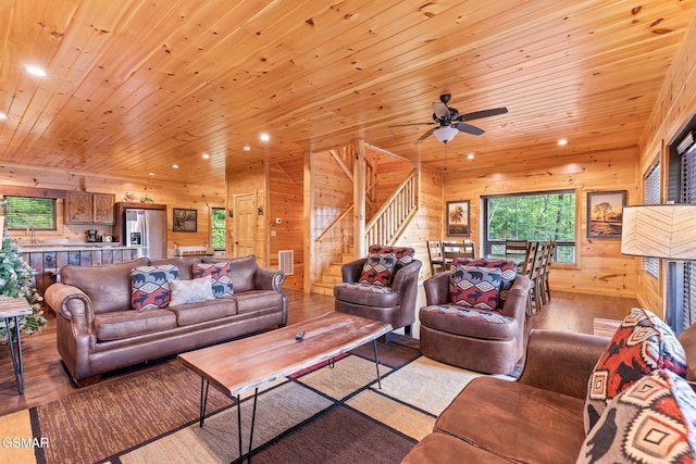 3181 Thomas Headrick Rd, Sevierville, TN 37862 - living area featuring recessed lighting, hardwood / wood-style flooring, wood walls, wooden ceiling, and stairway