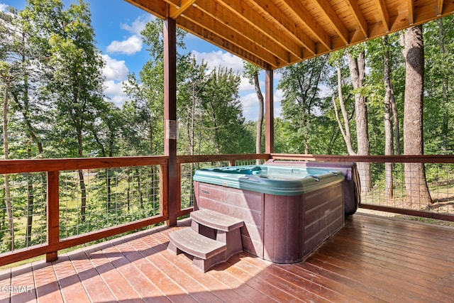 3181 Thomas Headrick Rd, Sevierville, TN 37862 - wooden terrace featuring a hot tub and view of wooded area