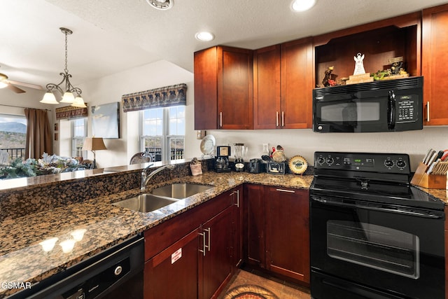 kitchen featuring a sink, black appliances, ceiling fan, and dark stone countertops