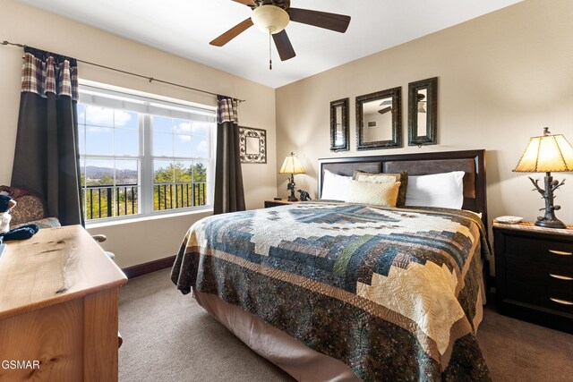 carpeted bedroom featuring baseboards and ceiling fan