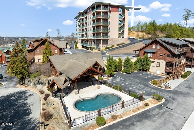 view of pool featuring a patio area and fence