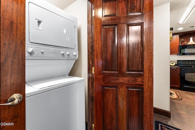 laundry area featuring laundry area and stacked washer / dryer